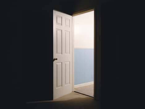 Light streaming through an open door, illustrating the section describing how the way is open for us to draw near to God.